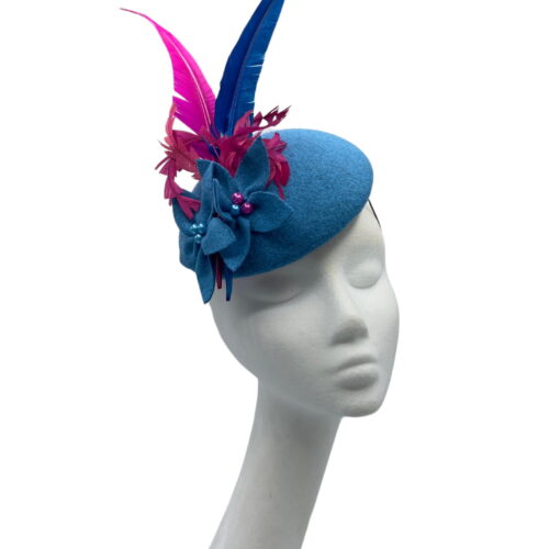 Blue felt headpiece with blue felt flowers, finished with pink and blue arrow feathers.